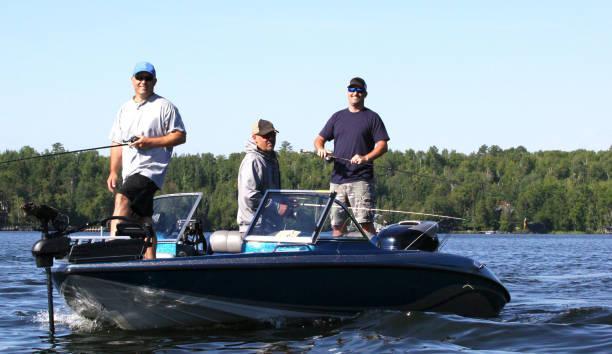 Three men in a blue boat, fishing