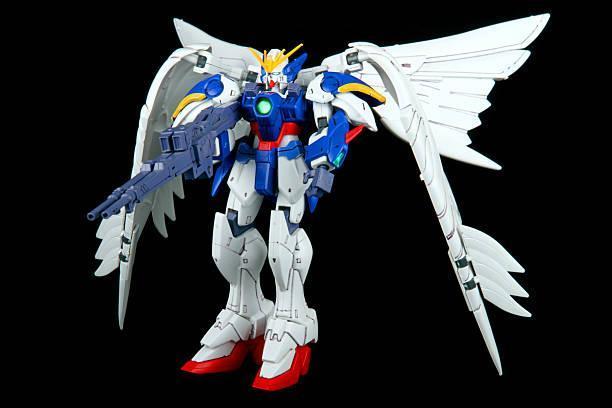 Winged Vengeance Vancouver, Canada - April 13, 2013: A model of the W-Gundam Zero Custom Mecha from the Gundam series of Animated TV shows. The model is posed on a black background and is manufactured by Bandai Gundam toys stock pictures, royalty-free photos & images